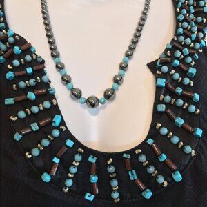 100% Silk Sheer overlay over lining with Turquoise accents